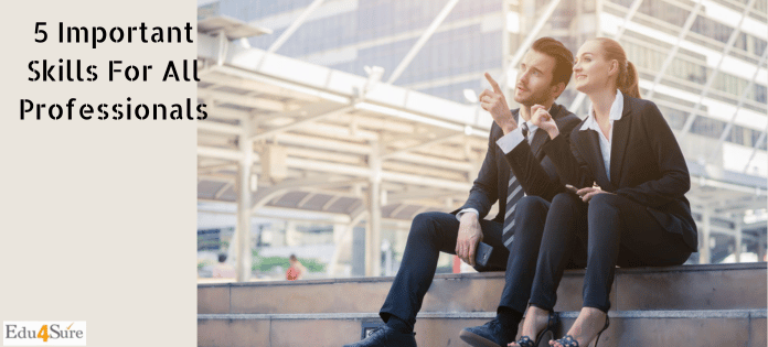 A man and woman sitting in a corporate professional attire.