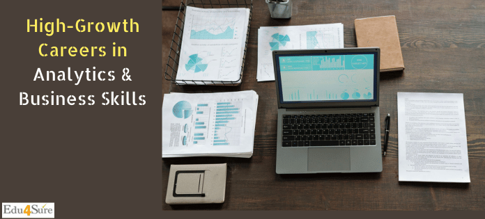 Laptop displaying business analytics dashboards with reports and charts spread on a desk, representing high-growth careers in analytics and business skills